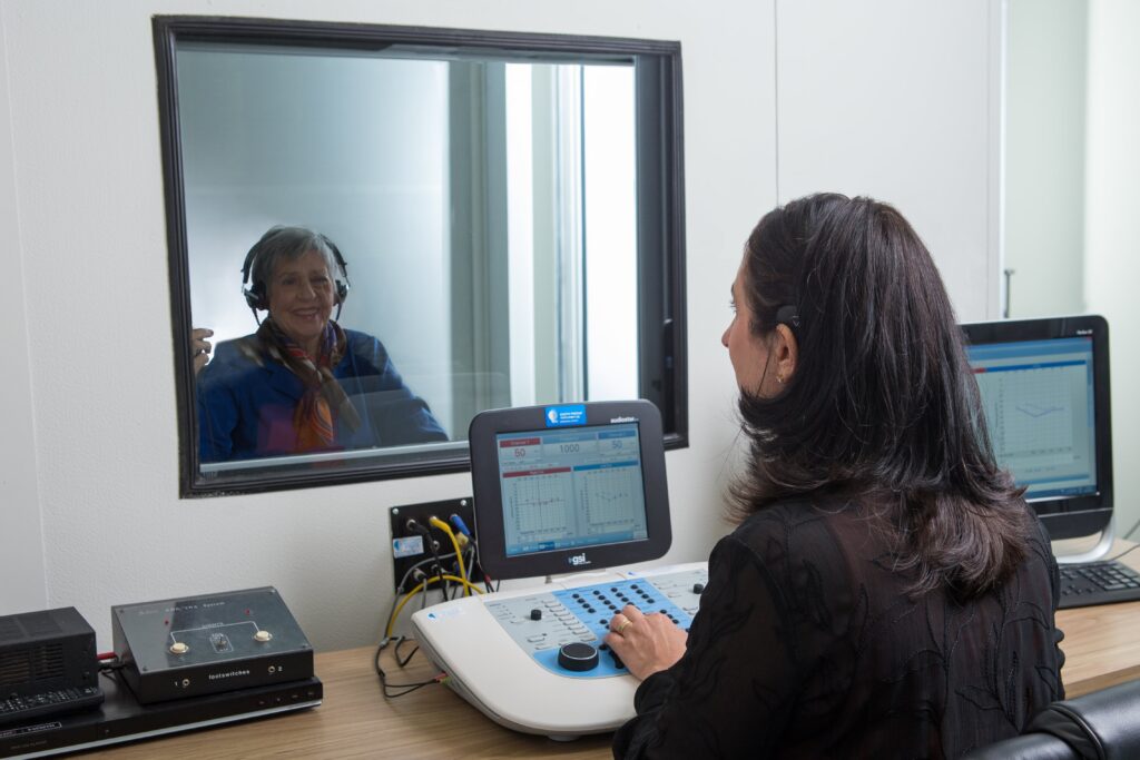 Do I need a hearing test in Toronto? Adult having a hearing assessment.