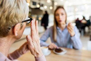older adult with hearing loss and cognitive health in a conversation